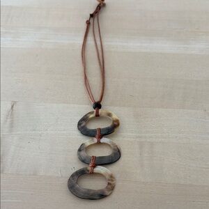 Brown and Tan Oval Shell Pendant Necklace with Button Closure